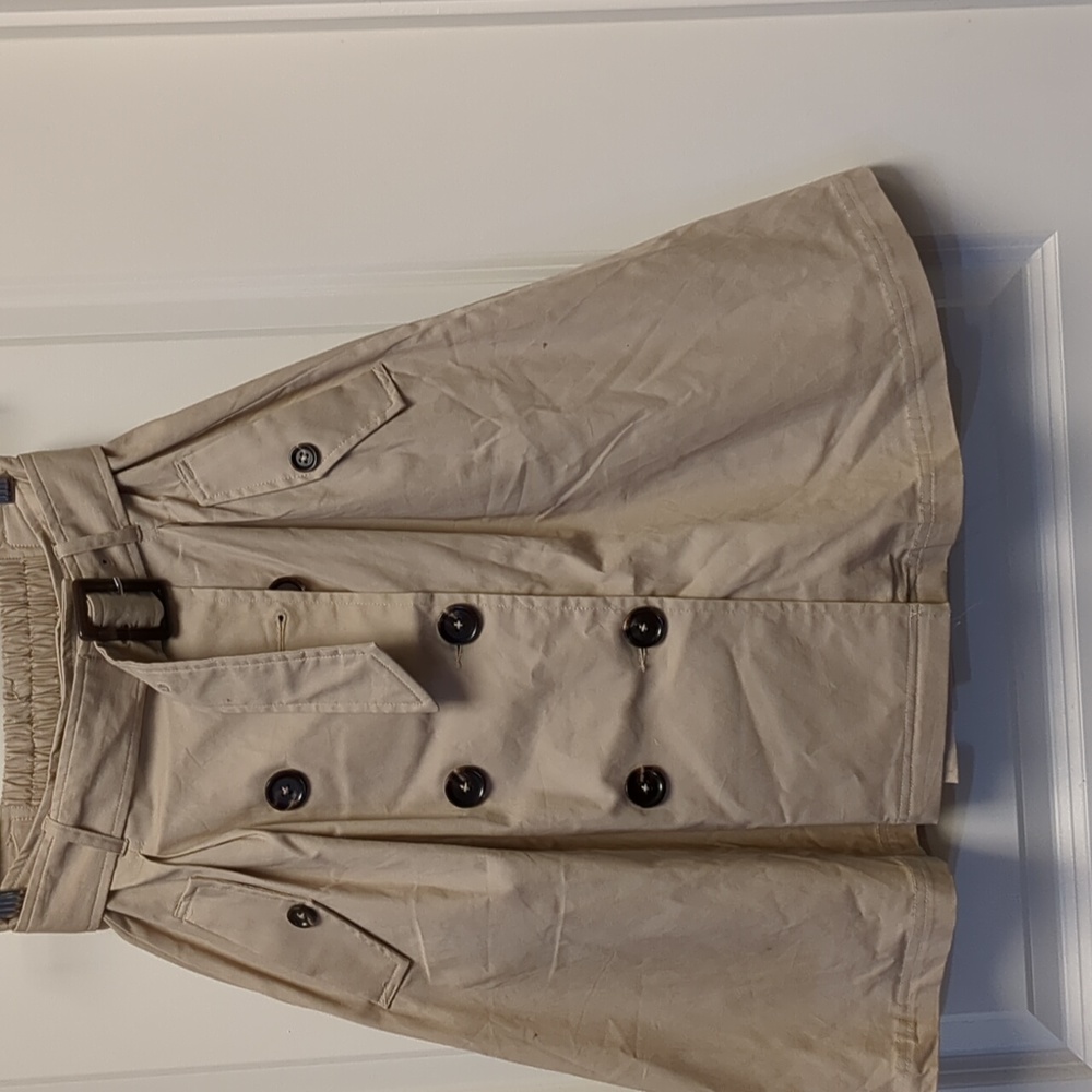 Modcloth label - Tan trenchcoat style midi skirt with pockets.